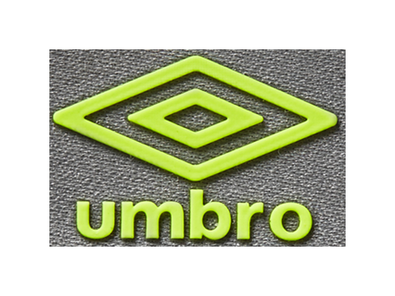 Vibrant lime green Umbro logo patch, showcasing the iconic double diamond and wordmark. The raised, 3D design, likely silicone/TPU, ensures prominent branding on sportswear and athletic shoes.